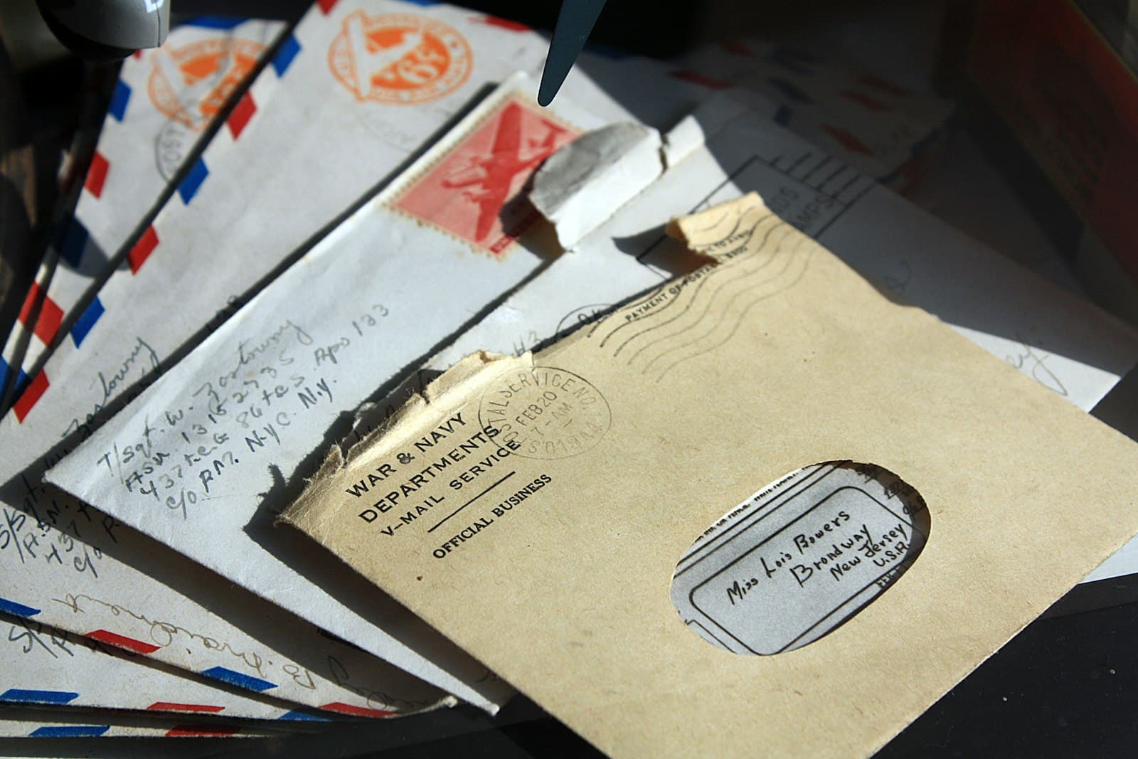A scattered pile of opened envelopes.